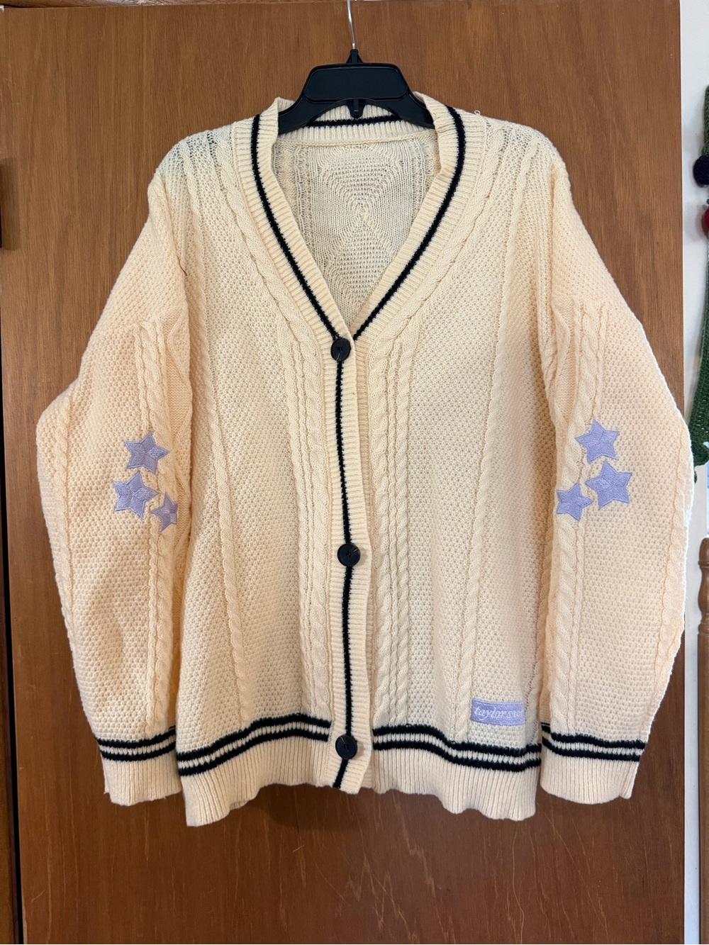 Taylor Swift Cream Cable Knit Cardigan with Black Trim and Lavender Star Patches